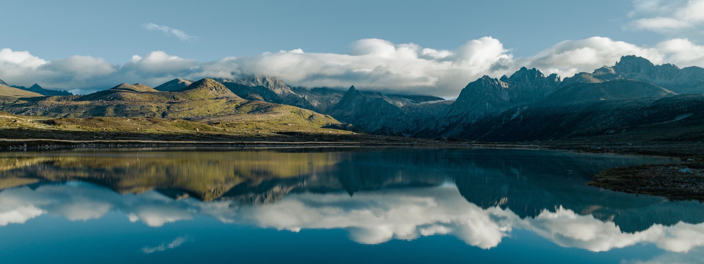 Still mountain lake at dawn